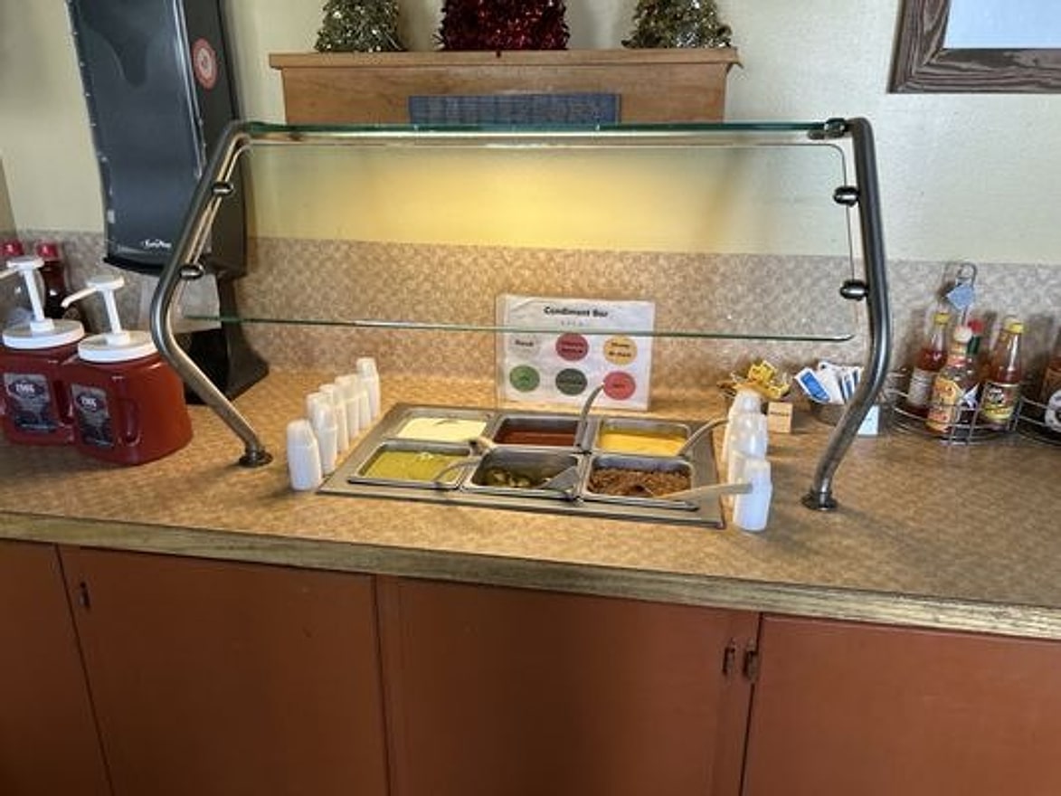 Self-serve condiment bar at Pecan St. Station Deli & Grill