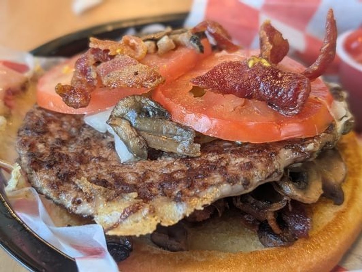 Open-faced mushroom bacon burger at Pecan St. Station